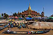Inle Lake Myanmar. Phaung Daw Oo Paya. Enshrined in the pagoda are five small ancient Buddha images that have been transformed into amorphous blobs by the sheer volume of gold leaf applied by devotees. 